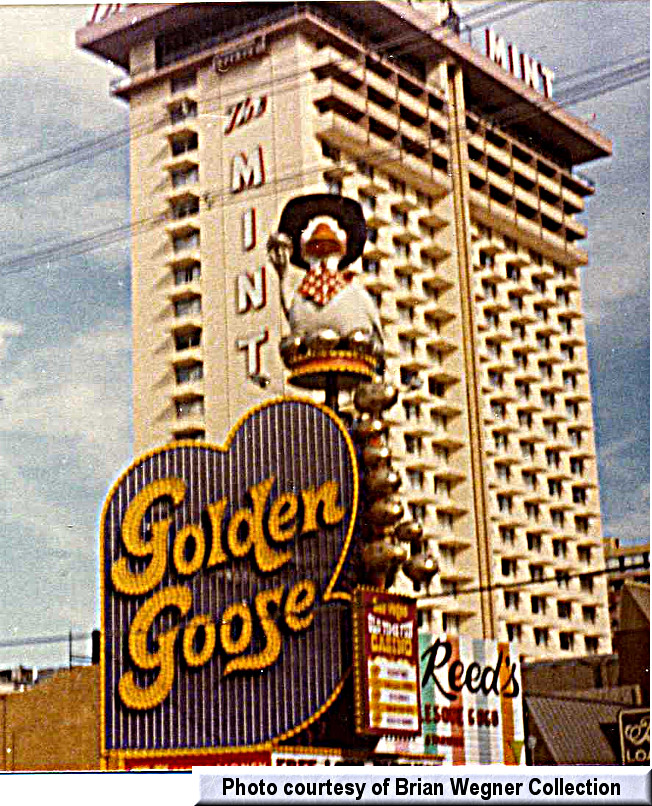 Mr. Reed's dwarfed by the Mint tower and tucked in next to the Golden Goose. 